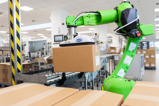 The cobot solution is alleviating health and safety issues by working collaboratively with human employees to pack and stack packets of tablets onto pallets