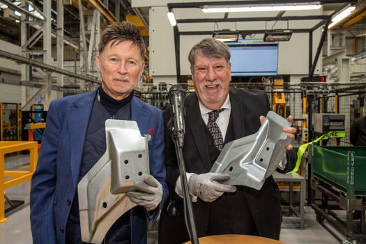 The first pressed part from the 800T Nidec Arisa Press was presented to Professor Carl Chinn, MBE (right) who officiated the event