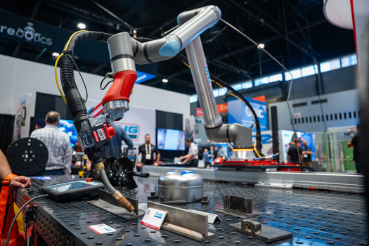 The new UR8 Long on a 7th axis linear rail in UR partner THG Automation's booth at FABTECH in Chicago