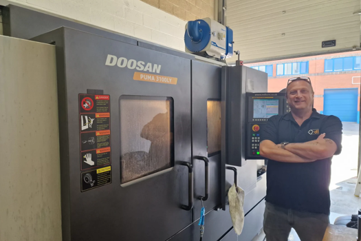 DLM’s latest recruit, Gary Owen, CNC turner, alongside a newly acquired lathe